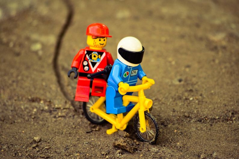 Confidence Boost - lego mini figure riding yellow bicycle
